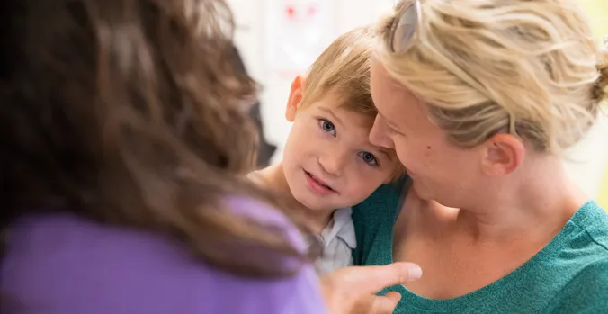 Child hugging teacher
