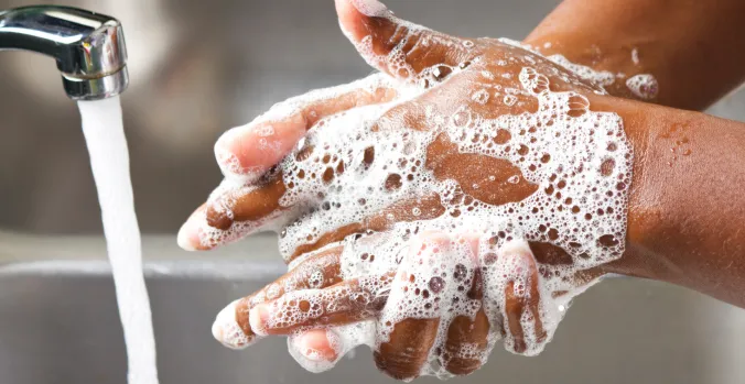 child washing hands
